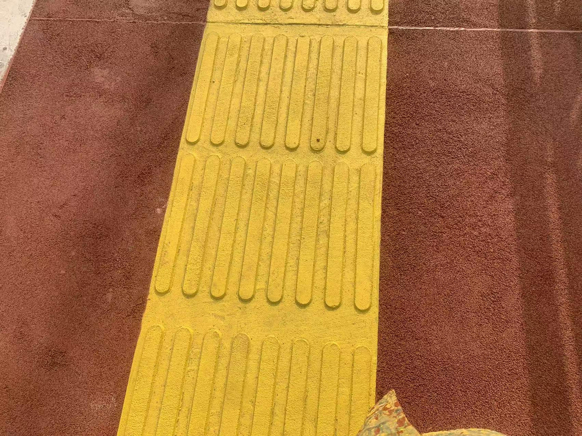 Tactile Paving for Visually Impaired Pedestrians: How Yellow Guidance Paths Make Walkways Safer